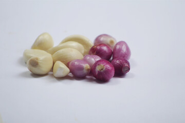 a collection of kitchen spices called garlic and onion mixed on a white background