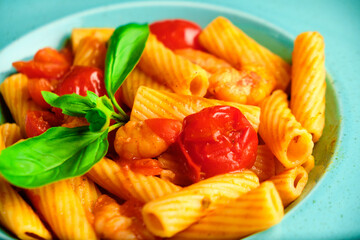 Italian recipe Pasta tortilloni with green pea, mint leaves, cheece, smoked bacon and cheese. Top view, blue background
