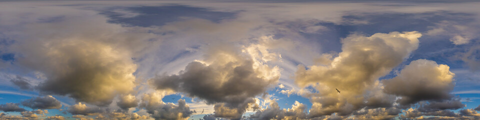 Dramatic sunset sky panorama with Cumulus clouds. Seamless hdr 360 pano in spherical...