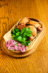 Chicken, Salmon and Meat Shish Kebabs on Parchment with Sauces Top View