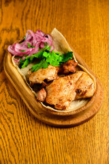 Chicken, Salmon and Meat Shish Kebabs on Parchment with Sauces Top View
