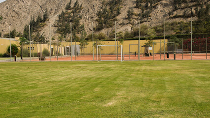 Soccer field with goal on grass in summer Cieneguilla, Lima, Peru