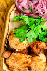 Chicken, Salmon and Meat Shish Kebabs on Parchment with Sauces Top View