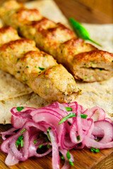 Juicy toasted kebab gyroscopic sausage Lyulya Minced