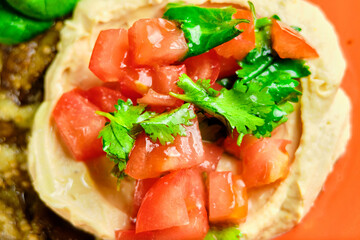 Green Risotto on a white restaurant plate.
