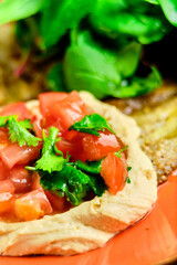 Green Risotto on a white restaurant plate.