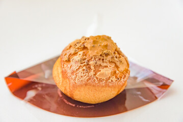 Profiterole, cream puff or chou a la creme, isolated on white background