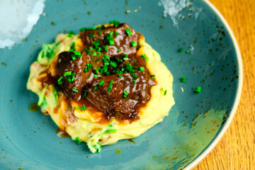 Beef risotto served in a plate with sauce a