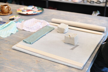 Materials and tools are ready for a pottery workshop class.