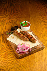 Juicy toasted kebab gyroscopic sausage Lyulya Minced