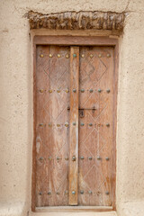 old wooden doors close up in Arabian style out of focus with grain