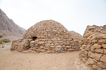 circular tombs with domes in Arabian desert build with rocks