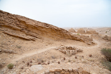 desert path with mountains and valleys dry out of focus with grain