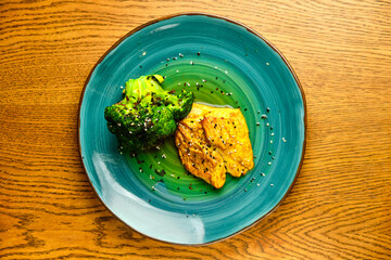 Fried chicken breast with broccoli