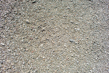Fine white gravel. Pavement of light fine crushed stone. Texture and structure of stones. Types of...