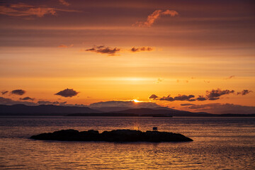  A setting sun makes for beautiful island silhouettes in the foreground and colorful skies above