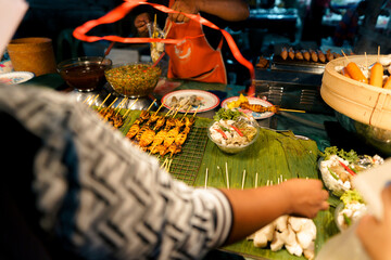Food at a street market in the evening in Krabi