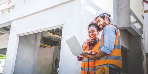 Architect caucasian man working with colleagues mixed race in the construction site.
