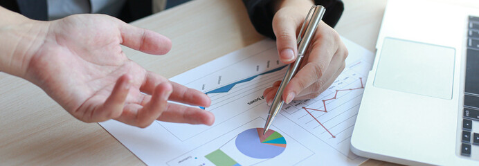 Chairman attended a meeting with accounting staff, using computers and graphs to analyze income - expenses and other company results, Financial conference concept..