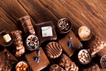 Praline Chocolate on wooden backgroud