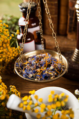 Book and Herbal medicine on wooden table background