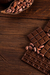 Dark and milk chocolate bar on a wooden table