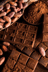 Dark and milk chocolate bar on a wooden table