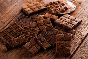 Dark and milk chocolate bar on a wooden table