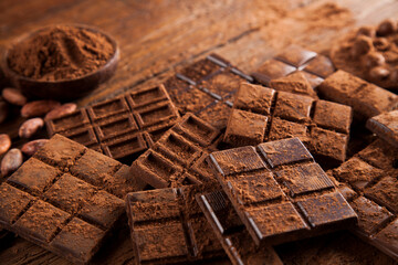 Chocolate bar, candy sweet, dessert food on wooden background