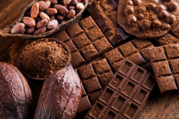 Dark and milk chocolate bar on a wooden table