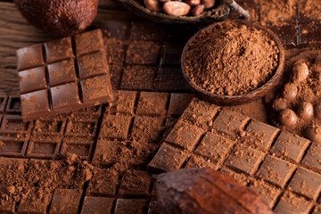 Dark and milk chocolate bar on a wooden table