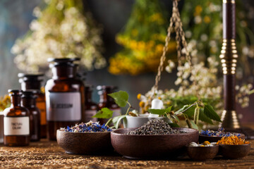 Herbs medicine,Natural remedy and mortar on vintage wooden desk background