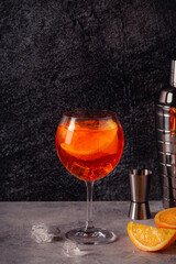 Glass of cold Aperol spritz cocktail.