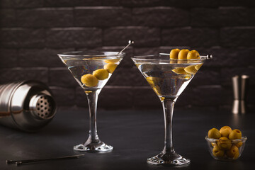 Martini cocktail on dark stone table.