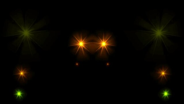 Animation yellow light sparkles on black background.
