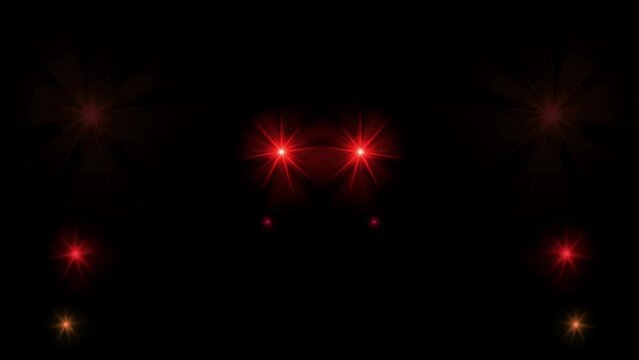 Animation red light sparkles on black background.
