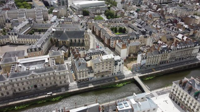 Zola-Chateaubriand footbridge with Palais du Commerce in background, Rennes in France. Aerial top-down circling