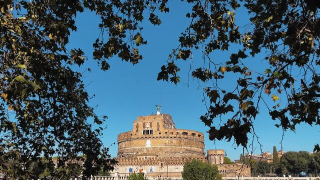 Tilt down shot of Tiber River, Bridge and famous Castle of the Holy Angel in Rome during pretty weather