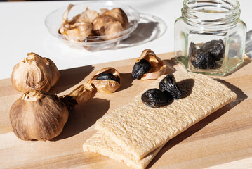 Fermented black garlic, health food. Healthy nutrition, fermented food, selective focus