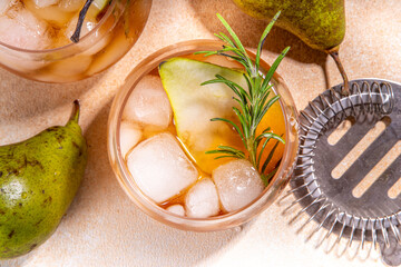 Alcohol fruity drink, Sweet cold pear cocktail with rum, liquor, anise and rosemary sprig,...
