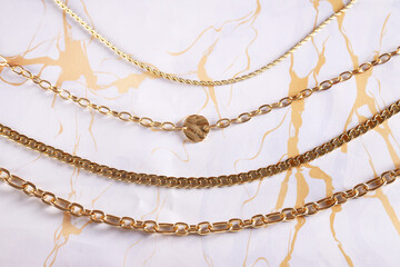 gold jewelry chain necklace on background