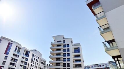Modern residential apartment house  architecture in europe. Innovative and resident-friendly architectural solutions.  Blue sky on the background. With sunlight.