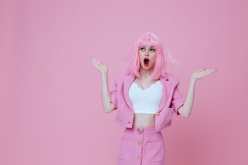 Beautiful fashionable girl gesturing with hands pink jacket lifestyle glamor color background unaltered