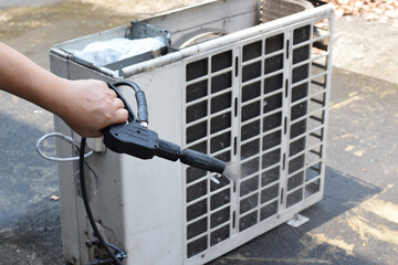 air condition cleaning concept. Technician cleanning air service and maintenance. Air condition Cleanning with Professional Cleanner