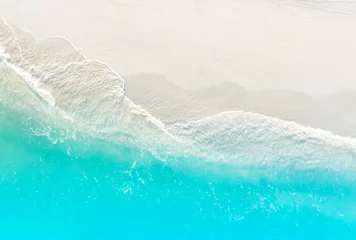 Foto op Canvas The aerial Top view of the tropical summer beach and water wave on the beach,top view image background © SASITHORN