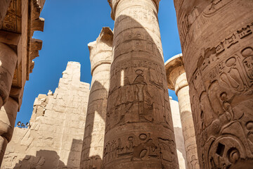 Different columns with hieroglyphs in Karnak temple. Karnak temple is the largest complex in...