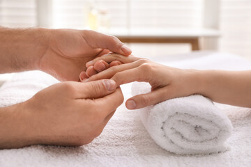 Obraz na płótnie Canvas Woman receiving hand massage in wellness center, closeup