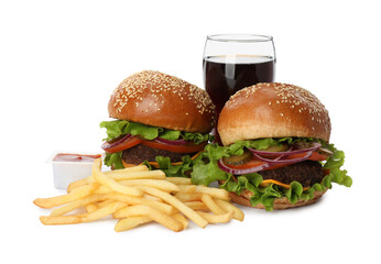 Burgers, French fries, ketchup and refreshing drink on white background. Fast food