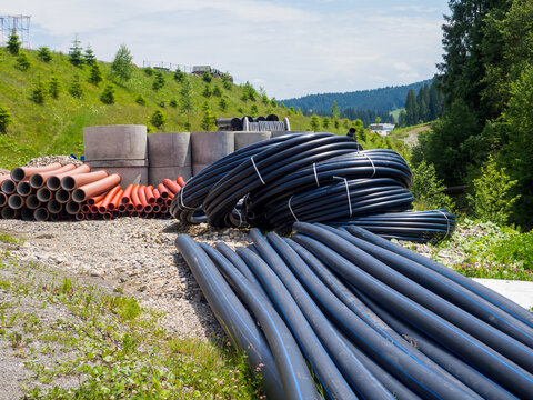 pipes in bays. Civil infrastructure pipe, water lines and sanitary storm. Preparation for earthworks for laying an underground pipeline. Modern water supply systems. Ground water drainage system pipes