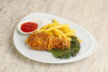 Crispy chicken leg with fry potato